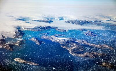 Icebergs float in a fjord after calving from glaciers on the Greenland ice sheet. AP