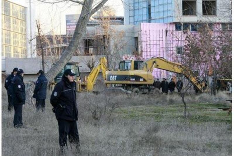 Forensic officers search for weapons in a wooded area in central Ankara in January.