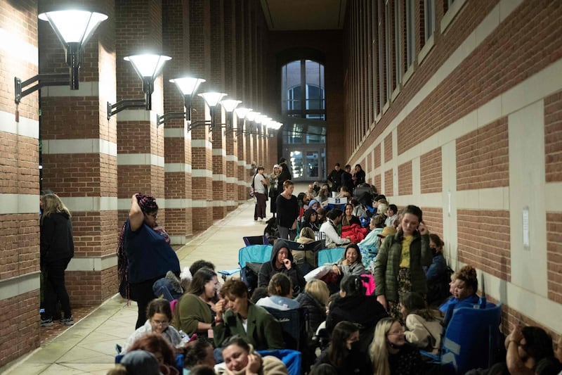 People waiting after midnight. AFP