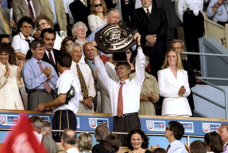 1 Aug 1999:  Arsene Wenger the manager of Arsenal lifts the charity shield after the FA Charity Shield match against Manchester United played at Wembley Stadium in London, England.  The match finished in a 2-1 victory to the Arsenal.   \ Mandatory Credit:Clive Brunskill /Allsport
