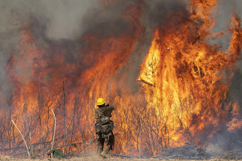 A firefighter monitors a controlled burn while fighting the Dolan Fire near Jolon, California, U.S., on Wednesday, Sept. 16, 2020. The wildfire burning in the rugged mountains of California's Big Sur coastline has burned more than 119,488 acres as of Tuesday and is 40% contained, according to the U.S. Forest Service. Photographer: Nic Coury/Bloomberg