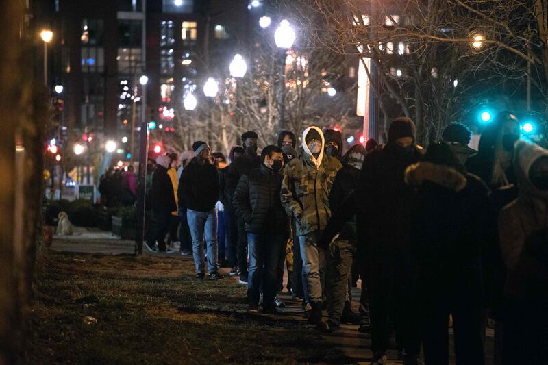 People line up to be tested for Covid-19 in Washington, DC. Omicron variant is now the main coronavirus variant in the US. AFP