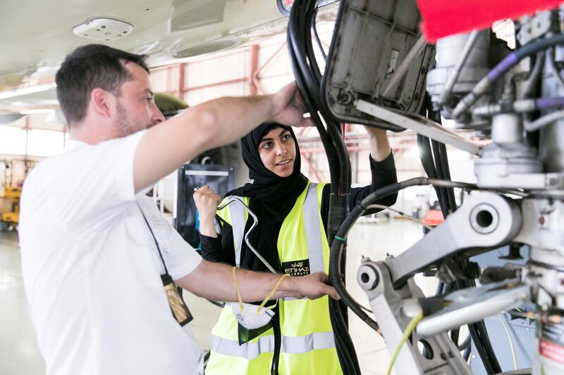 ABU DHABI, UNITED ARAB EMIRATES - OCT 24:

Shaikha Al Remaithi about to replace a seal on an Etihad aircraft at Etihad Airways Engineering facilities.

(Photo by Reem Mohammed/The National)

Reporter: MUSTAFA ALRAWI
Section: BZ