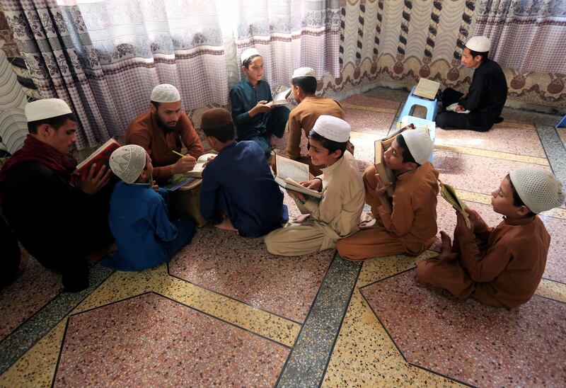Afghan boys read the Quran in Jalalabad, Afghanistan. Reuters