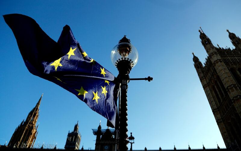 A European flag flies opposite the Houses of Parliament as Pro-European demonstrators protest in London, Monday, Jan. 14, 2019. British Prime Minister Theresa May planned to tell lawmakers Monday that she has received further assurances about her Brexit deal from the European Union, in a last-ditch attempt to stave off a crushing defeat for the unpopular agreement. (AP Photo/Frank Augstein)