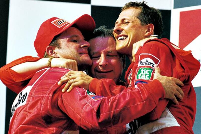 FILE - OCTOBER 04, 2012:  Michael Schumacher has announced his retirement from Formula One after a career spanning two spells during which he won a total of seven world titles, including five straight titles during his time with Ferrari. 19 Aug 2001:  Ferrari driver Rubens Barrichello, sporting director Jean Todt and Michael Schumacher celebrate after the Formula One Hungarian Grand Prix held at the Hungaroring in Budapest, Hungary.  Michael Schumacher won the race securing the Drivers Championship for the fourth time. \ Mandatory Credit: AllsportUK  /Allsport