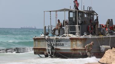 US soldiers assessing the situation on an Army vessel that ran aground at a beach in Israel's coastal city of Ashdod. EPA