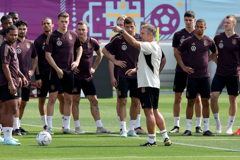 Germany coach Hans-Dieter Flick talks to his players during a training session at Al Shamal Stadium in Al Ruwais on November 19, 2022, ahead of the Fifa World Cup. Getty