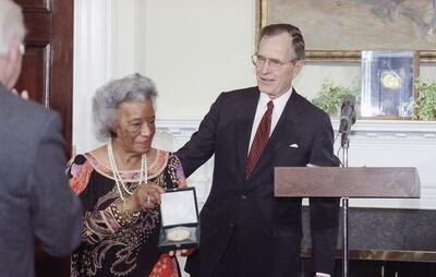 Mandatory Credit: Photo by Barry Thumma/AP/Shutterstock (5983551a)
President George Bush presents Ruth Owens, wife of Olympic star Jesse Owens, with a Congressional Gold Medal on in Washington during a ceremony at the White House. The president presented the medal to Mrs. Owens for Jesse's "humanitarian contributions in the race of life
Bush Medal For Owens, Washington, USA