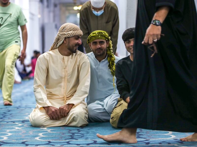 Worshippers prepare to pray on the first day of Eid in Abu Dhabi. Victor Besa / The National