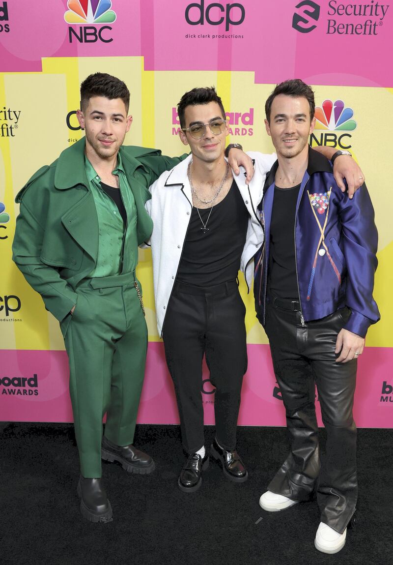 LOS ANGELES, CALIFORNIA - MAY 23: (L-R) Nick Jonas, Joe Jonas, and Kevin Jonas of Jonas Brothers pose backstage for the 2021 Billboard Music Awards, broadcast on May 23, 2021 at Microsoft Theater in Los Angeles, California. (Photo by Rich Fury/Getty Images for dcp)