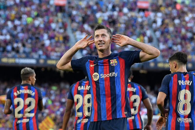 Robert Lewandowski celebrates after scoring Barcelona's first goal against Real Valladolid. AFP