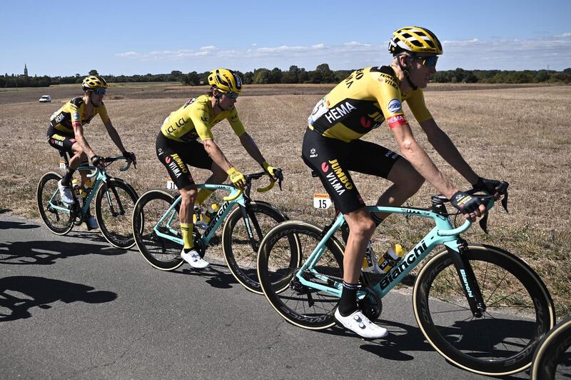 Team Jumbo's Primoz Roglic, centre, wearing the overall leader's yellow jersey. AFP