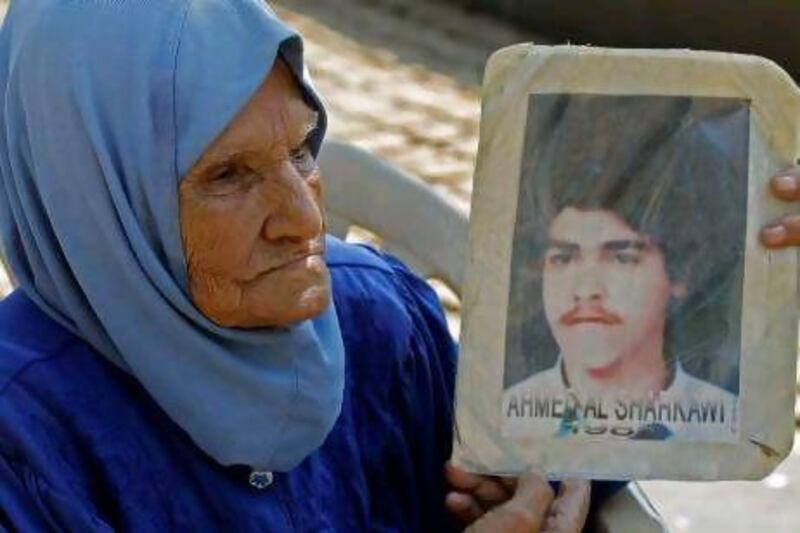 A woman takes part in a sit-in to demand information about Lebanese prisoners in Syria outside the UN offices in Beirut.