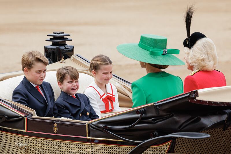 Prince George of Wales, Princess Charlotte of Wales and Prince Louis of Wales ride in a horse drawn carriage with Catherine, Princess of Wales and Queen Camilla during Trooping the Colour at Horse Guards Parade in London. Getty