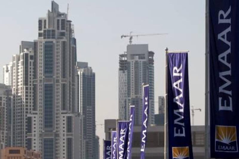 Flags belonging to Dubai's Emaar Properties, builders of the Burj Khalifa, the world's tallest tower, are seen in Dubai, in this November 27, 2009 file photograph. Emaar Properties is creating a core management team to develop a new growth strategy, the developer's chairman Mohamed Alabbar said, following social and political upheaval in the region. Alabbar, who heads the team, said in a statement that it would focus on "strengthening the resilience of the organisation in the wake of recent social, political and economic changes in its regional and global markets". Picture taken November 27, 2009.
 REUTERS/Steve Crisp/Files (UNITED ARAB EMIRATES - Tags: BUSINESS) *** Local Caption ***  SIN602_EMAAR-REVIEW_0507_11.JPG