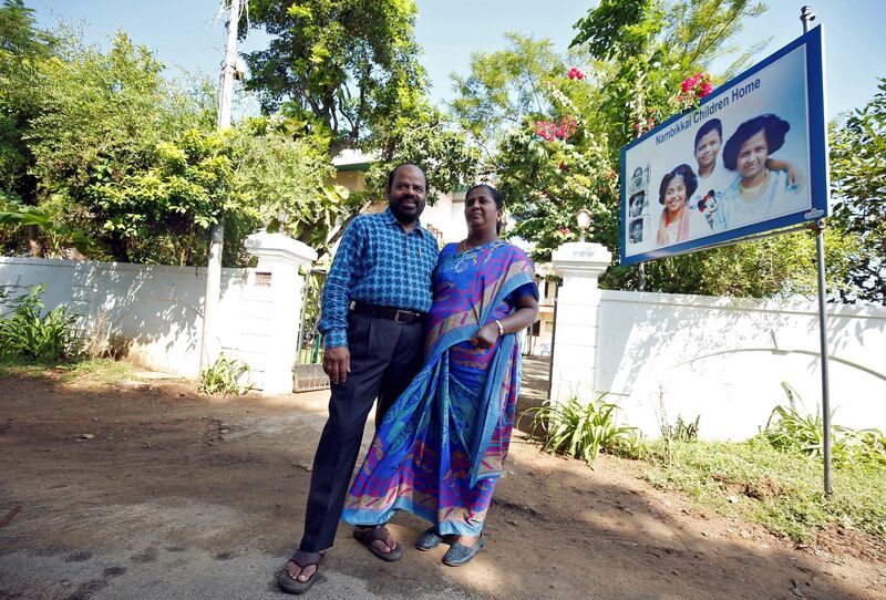 Karibeeran Paramesvaran and his wife Choodamani, who lost three children in the 2004 tsunami, pose outside their house that they have turned into a care home for orphaned children in Nagapattinam district in the southern state of Tamil Nadu, India. REUTERS