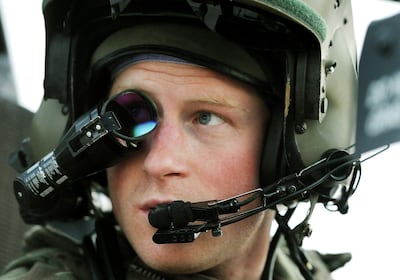 Prince Harry wearing a monocle gun sight in a gunship cockpit at Camp Bastion, southern Afghanistan. AP 