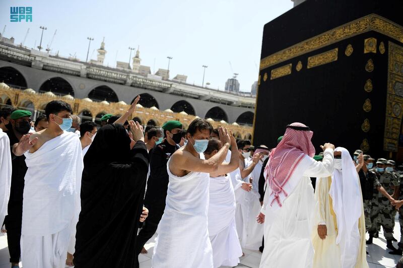 Pakistan's Prime Minister Imran Khan performs tawaf on the 27th day of Ramadan with his wife, Bushra Bibi, at the Grand Mosque, in Makkah, Saudi Arabia.