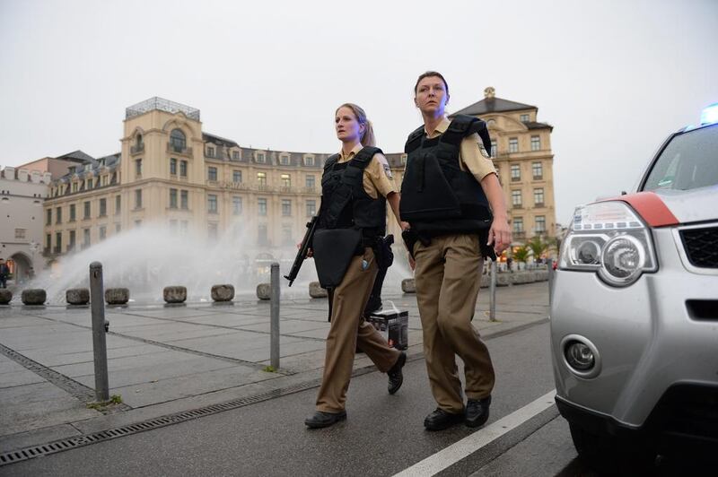 Police officers in protective gear at Munich’s Karlsplatz square after the shooting in the OEZ shopping centre in Munich, capital of the southern German state of Bavaria, on July 22, 2016. Andreas Gebert / dpa via AP