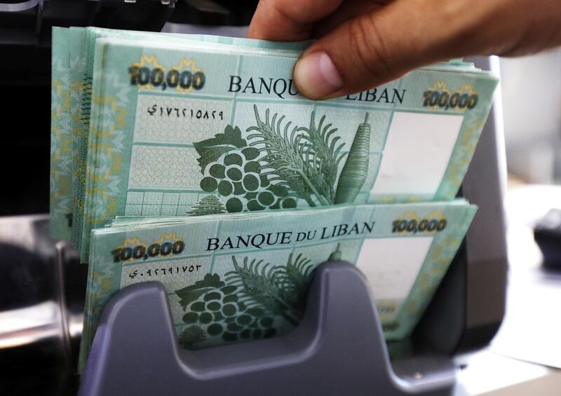 FILE PHOTO: Lebanese pound banknotes are seen at a currency exchange shop in Beirut, Lebanon June 15, 2020. REUTERS/Mohamed Azakir/File Photo