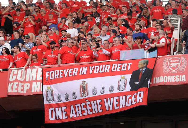 Arsenal's fans display a banner in hounour of Arsene Wenger. Matt Dunham / AP Photo