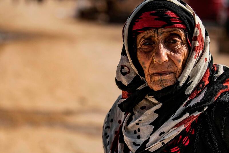An elderly Syrian woman, displaced from Ras Al Ain, a border town controlled by Turkey and its Syrian proxies, is pictured in the camp of Washokani in the northeastern Syrian Al Hasakeh governorate. AFP