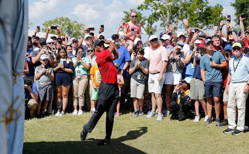 Mar 18, 2018; Orlando, FL, USA;  After taking relief, Tiger Woods hits his second shot to the green on the ninth hole during the final round of the Arnold Palmer Invitational golf tournament at Bay Hill Club &  Lodge . Mandatory Credit: Reinhold Matay-USA TODAY Sports