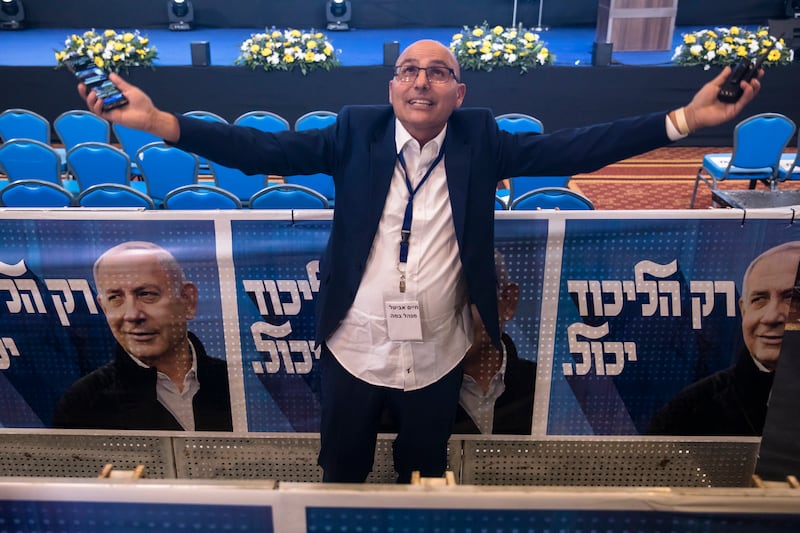 A Likud party supporter responds to favourable exit polls. Getty 