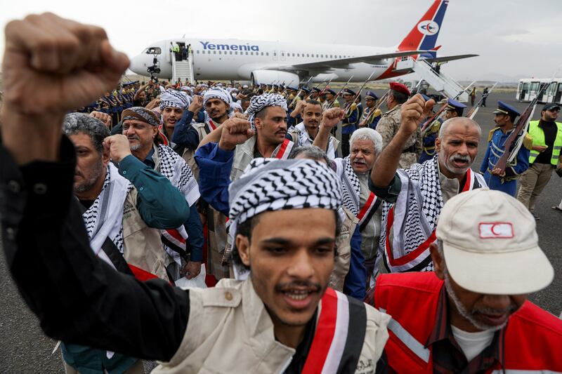 Freed prisoners of war walk at Sanaa Airport, after arriving on a flight chartered by the  International Committee of the Red Cross as part of a prisoner swap between the rival sides in the Yemen conflict. Reuters