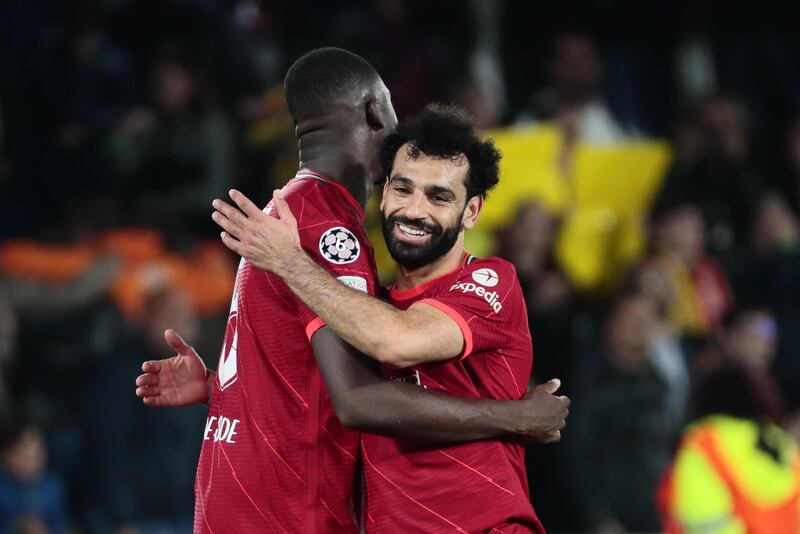 Liverpool's Mohamed Salah (R) celebrates with teammate Ibrahima Konate their win after the UEFA Champions League semifinal, second leg soccer match between Villarreal CF and Liverpool FC in Villarreal, Spain, 03 May 2022.   EPA / Biel Alino