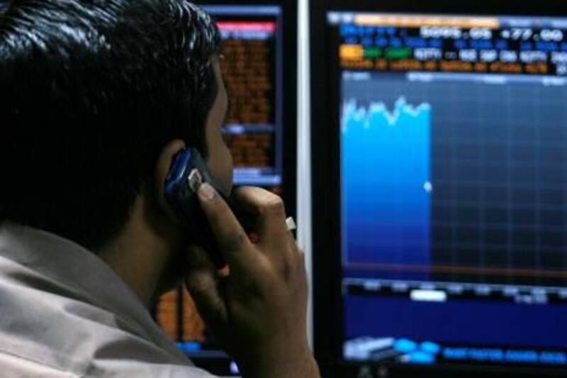 A broker looks at computer screens at a stock brokerage firm in Mumbai May 10, 2010. Indian shares extended gains to more than 2 percent by late morning on Monday, helped by strong Asian peers and investor relief in the wake of a $1 trillion rescue package to contain the Greek crisis and calm world markets.  REUTERS/Arko Datta (INDIA - Tags: BUSINESS) *** Local Caption ***  DEL01_INDIA-STOCKS-_0510_11.JPG