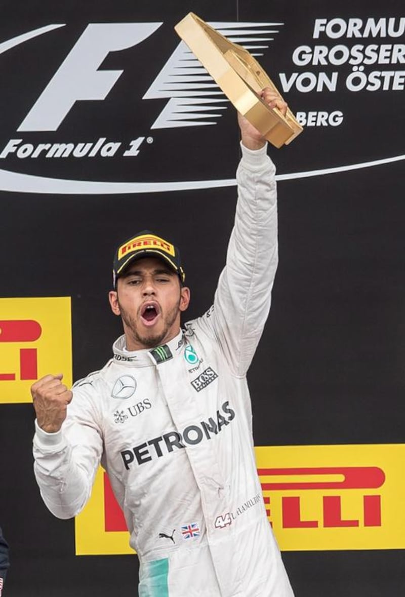 Winner Lewis Hamilton of Mercedes celebrates on the podium after the Formula One Austrian Grand Prix in Spielberg, Austria, 03 July 2016. Johann Groder / EPA