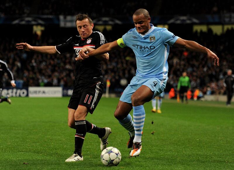 MANCHESTER, ENGLAND - DECEMBER 07:  Ivica Olic of FC Bayern Muenchen competes with Vincent Kompany of Manchester City during the UEFA Champions League Group A match between Manchester City and FC Bayern Muenchen at the Etihad Stadium on December 7, 2011 in Manchester, England.  (Photo by Michael Regan/Getty Images)