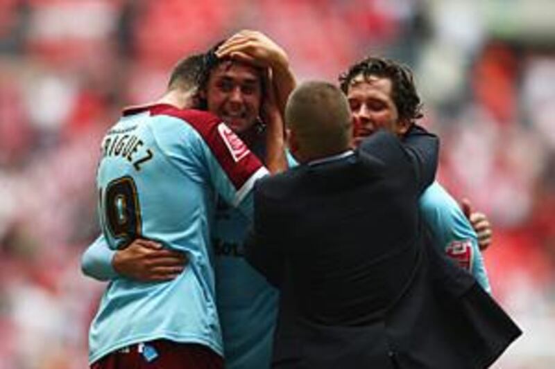 Burnley players celebrate after winning the Championship play-off final against Sheffield United at Wembley.