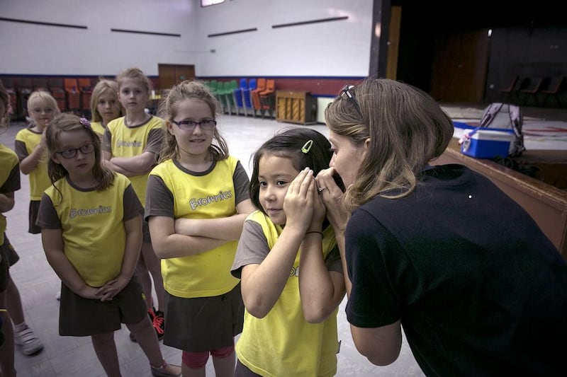 Brownies play a game during one of their regular weekly meetings at St Andrew’s Hall in Mushrif, Abu Dhabi. Volunteers are urgently needed to keep some of the units from closing. Silvia Razgova / The National  