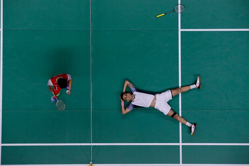 Lakshya Shen, right, of India reacts after winning the men's singles final against Anthony Ginting of Indonesia at the BWF Thomas and Uber Cup in Thailand on Sunday. EPA