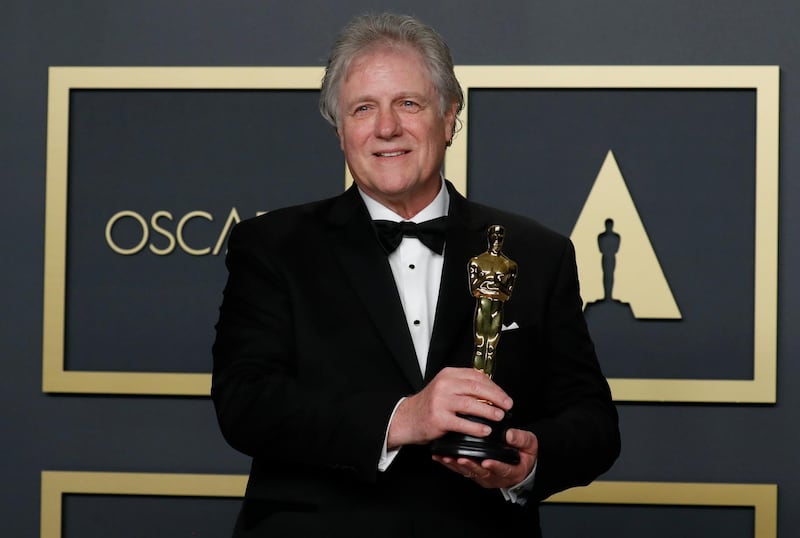 Donald Sylvester poses with the Oscar for Best Sound Editing for 'Ford v Ferrari'  at the 92nd Academy Awards on Sunday, February 9. Reuters
