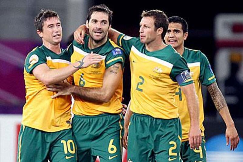 Lucas Neill, second right, wants to lead Australia to their third successive World Cup finals appearance.