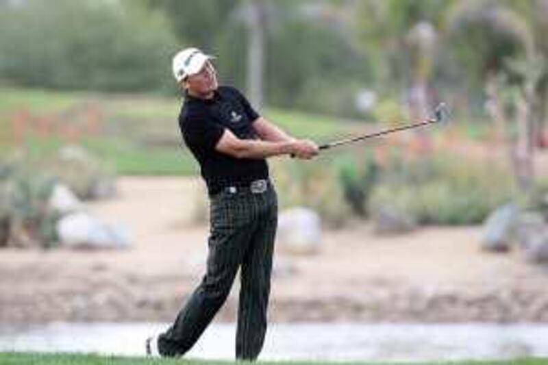 ABU DHABI, UNITED ARAB EMIRATES - JANUARY 15:  Jarmo Sandelin of Sweden plays his second shot at the 9th hole during the first round of the Abu Dhabi Golf Championship held at the Abu Dhabi Golf Club on January 15, 2009 in Abu Dhabi, United Arab Emirates  (Photo by David Cannon/Getty Images) *** Local Caption ***  GYI0056491565.jpg