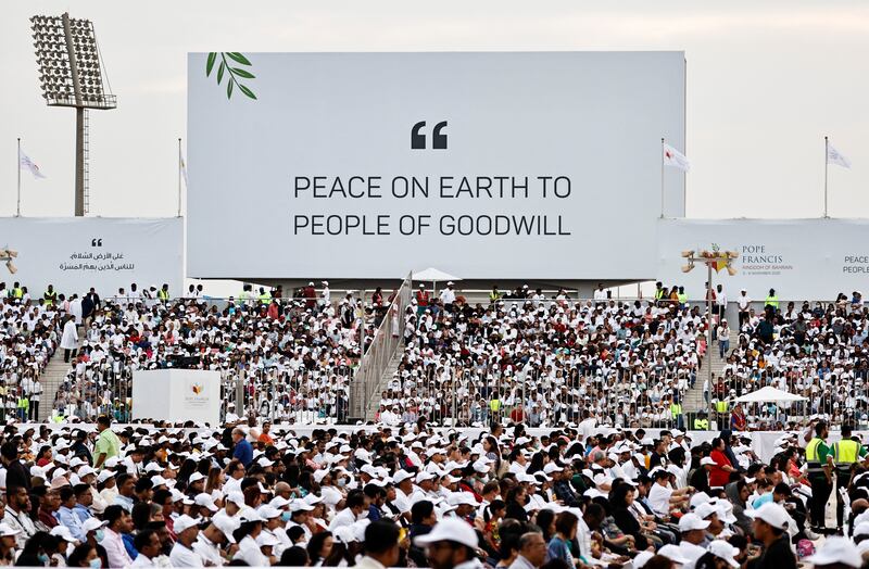 People gather to attend holy Mass at Bahrain National Stadium. Reuters