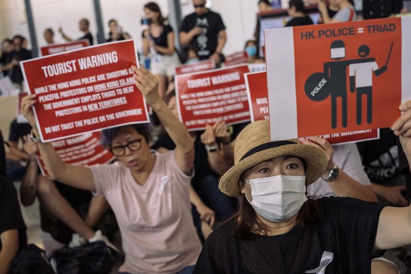 Protesters rally against the extradition bill in the arrivals hall. Getty Images