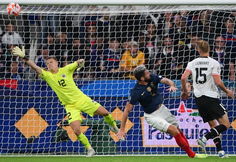 France forward Olivier Giroud scores past Austria's goalkeeper at Stade de France in Saint-Denis, north of Paris. AFP