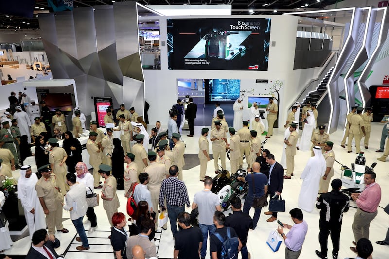 Dubai, United Arab Emirates - October 9th, 2017: Standalone. People at the Dubai police stand at 37th GITEX technology week. Monday, October 9th, 2017 at World Trade Centre, Dubai. 