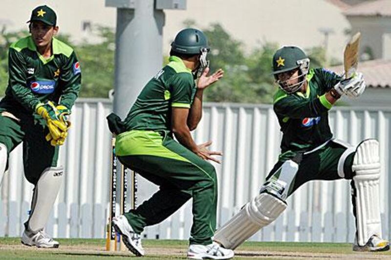 Umar Akmal, right, is more focused on batting while brother Adnan, left, is a specialist keeper.