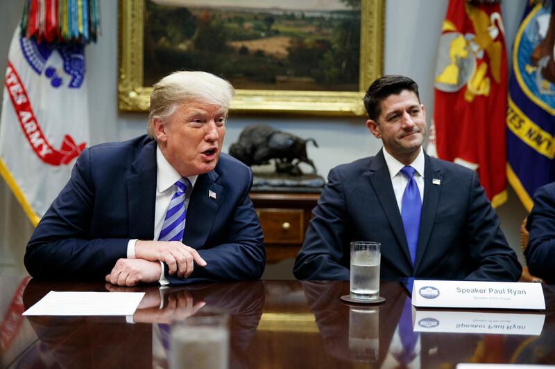 FILE - In this Sept. 5, 2018, file photo, then-Speaker of the House Paul Ryan, R-Wis., listens to President Donald Trump speak during a meeting with Republican lawmakers in the Roosevelt Room of the White House in Washington. Ryan is weighing in on the fight for the Republican Partyâ€™s future and he's urging conservatives to reject Donald Trump and â€œsecond-rate imitations.â€ Ryan is making the remarks in a speech May 27, 2021, at the Ronald Reagan Presidential Library in California. (AP Photo/Evan Vucci, File)