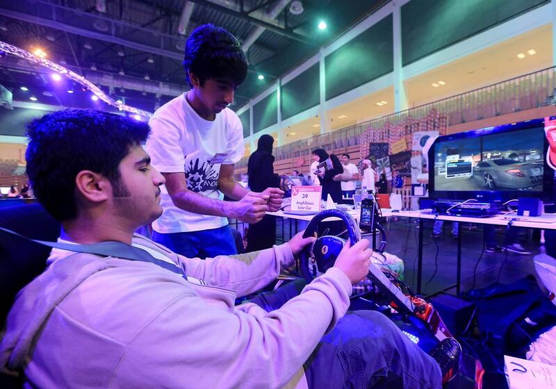 Sultan al Zaabi, left, and Khalifa al Shehhi, grade 12 students from Applied Technology High School with their creation, the Driver Fatigue detection system. Ravindranath K / The National
