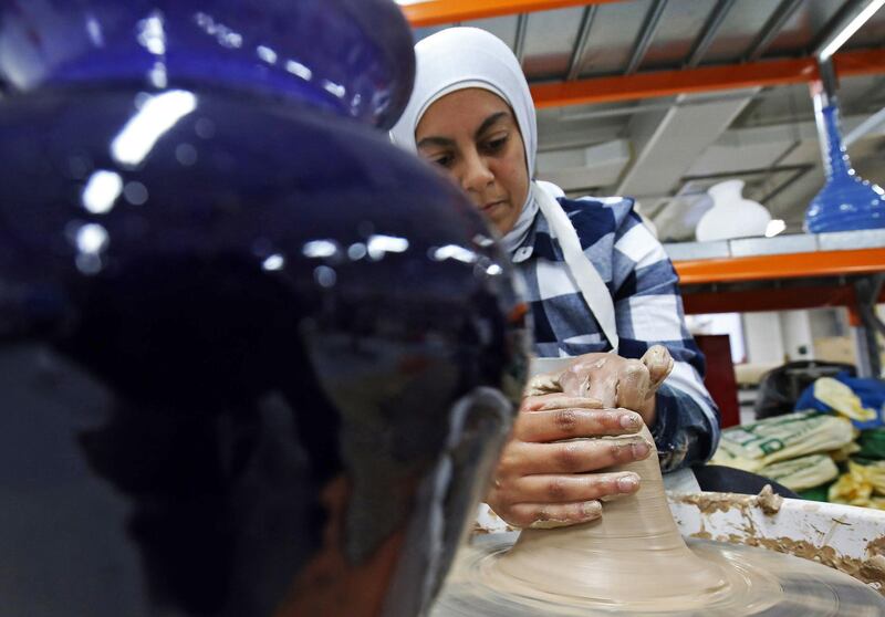 A Kuwaiti woman makes pottery at a handicrafts centre in Kuwait City.  AFP