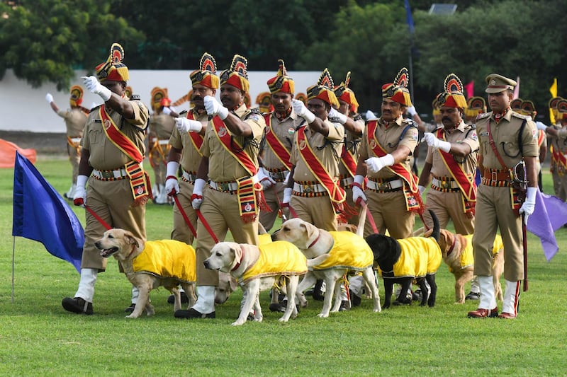 Indian Railway Protection Force dog squad personnel march in Secunderabad during a ceremony to celebrate Independence Day. AFP