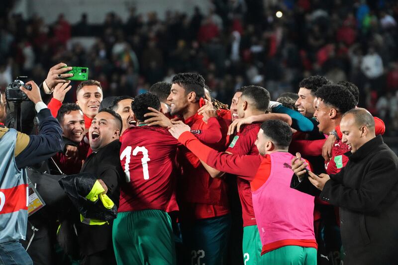 Morocco players celebrate after the win against DR Congo. AP